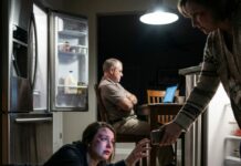 My husband shoved me against the refrigerator, then kicked me so hard with his knee that my nose broke. I was bleeding, trembling, and reached for my phone—until my mother-in-law snatched it away. “Just a small scratch,” she snapped. And my father-in-law? “Drama queen,” he muttered. They had no idea what I was going to do next.