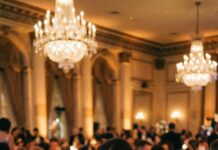 I was halfway through my steak when my phone lit up. “You’re fired. Budget cuts.” That was it. No call. No warning. I looked up and saw him laughing under the chandeliers, shaking hands like a king. Twelve years erased by one text—at a gala I built. I smiled, raised my glass, and thought, He has no idea what he just started.