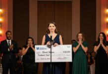 I was standing onstage, holding a two-million-dollar check, when my phone buzzed. “You’re fired.” I looked up at three hundred donors, cameras rolling, my boss smiling offstage like a king who thought he’d already won. So I leaned into the mic and said, “Well… apparently I’ve just been fired.” That’s when the room stopped breathing—and everything changed.