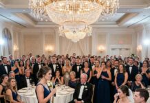 I Raised My Daughter Alone, and at Her Wedding Her Wealthy Father-in-Law Tried to Humiliate Me in Front of 300 Guests — Until I Calmly Stood Up and Asked, “Do You Even Know Who I Am?” and Watched the Ballroom Go Silent Under the Crystal Chandelier Lights