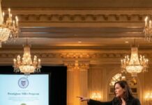 “My company is failing,” my wife said into the microphone, pointing straight at me. Two hundred people turned. “Tomorrow, my father and I will buy it and put it out of its misery.” The room applauded. I sat there, silent, burning. They thought this was my ending. What they didn’t know was that by morning, everything they believed about me—and about power—was about to collapse.