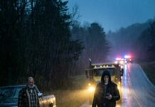 “BAM!” The car folded like paper and flipped. I clawed my way out, metal biting my skin, blood soaking my shirt—sliding into the corner of my eyes until the world blurred red. Through the ringing in my skull, I saw a figure in the distance. “No… it can’t be you,” I whispered. He didn’t run to me. He just stood there—my husband. Then my phone buzzed: “Finish her.” And his screen lit up too.