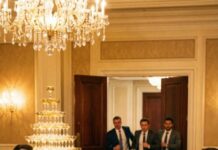 Eight months pregnant, I followed my husband into his promotion party, smiling until my cheeks ached. But his eyes never left his secretary—too soft, too hungry. “Are you okay?” I whispered. He laughed, raised his glass, and said, “Since you’re so curious… let’s make it public.” Then he turned to the room. “Ask her who the father is.” The laughter hit me like slaps—until the doors swung open. Three men in suits walked in. My brothers. Billionaires. And my husband’s pride began to collapse.