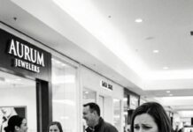 I was holding my eight-year-old’s hand, ticking off a baby list in my head—bottles, tiny onesies, a blanket soft enough for a newborn. The mall lights felt too bright, my belly too heavy. Then I saw him. My husband, laughing like he’d forgotten how to breathe at home—his fingers fastening the newest necklace around another woman’s throat. My son’s voice cut through everything, small and clear: “Mom… that’s Dad.” I didn’t turn away. I stepped closer. And that was the moment he finally looked up… and realized I wasn’t alone.