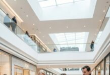 “I raised you into this family, and this is how you embarrass me?” my mother-in-law screamed as her hands tore my dress apart. People gasped. Phones flashed. I stood shaking in my underwear while she laughed and said, “This is what trash deserves.” I thought my life was over—until two unfamiliar voices cut through the crowd: “Step away from our sister.” That was the moment everything changed.