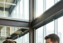 “They’re eliminating legacy roles,” Matt said, standing behind my chair like he already owned it. “Effective immediately, Dana Miller is no longer with the company.” The room went silent. I stood up slowly and smiled. No yelling. No begging. Because what he didn’t know—what no one in that room knew—was that the company’s federal licenses didn’t belong to the building. They belonged to me. And I had just signed the fuse.