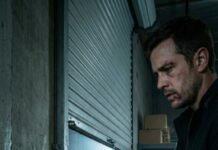 “His voice cut through the darkness—calm, certain. ‘Don’t hide anymore… I can see you.’ My lungs froze. I pressed my back to the cold wall, fingers shaking around my phone with 0% signal. The footsteps stopped right outside my door, then—soft laughter. ‘You always choose the same place,’ he whispered, like we were lovers sharing a secret. I swallowed a scream… because I knew that voice. And I knew who shouldn’t be alive.