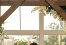 On my wedding day, I forgot my phone—and that tiny mistake saved my life. I rushed back to the dressing room and froze at the door. My fiancé was on a call, voice low, ruthless. “Relax,” he chuckled. “She’s the next one. After the vows, the money’s clean.” My stomach turned. A con artist. A hunter of women like me. I swallowed the scream, steadied my hands, and walked back smiling. Minutes later, the officiant asked, “Do you take—” And the doors exploded open. “POLICE! Hands where we can see them!” He looked at me, eyes wide. “Babe… what is this?” I leaned in, whispering, “The part you didn’t plan.”