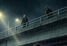 Rainwater dripped off the bridge like a ticking clock. I’m four, and the concrete is my ceiling. People step over my shadow and don’t look down. Then he stopped. “Hey, little one,” the kind-faced man in simple clothes whispered, holding out half a bun. “Why are you here… alone?” I backed up, clutching my blanket. “If I tell you,” I breathed, “they’ll find us.” His smile didn’t move—but his eyes did. “Who will?” I didn’t answer. Above us, footsteps slowed… and someone called my name.