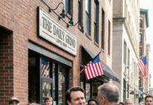 He called it a “prank.” I called it abandonment. The taillights vanished as my husband leaned out the window laughing, “Good luck!”—300 miles from home, no phone, no mercy. I didn’t go back. I rebuilt myself in silence… and I made sure he could never reach me again. Five years later, he finally found me. “Babe…?” he whispered—until the man behind me stepped forward. His smile died. And mine began.