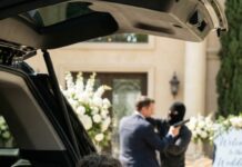 On the morning of my daughter’s wedding, our family driver suddenly shoved me into the trunk and slammed it shut. “What the hell are you doing?!” I screamed, kicking the metal. His voice came tight and urgent: “Sir—hide. Don’t say a word. You need to see this… trust me.” Minutes later, I peered through a narrow crack—and my blood turned to ice. Whoever was outside wasn’t supposed to be here… and they were coming closer.