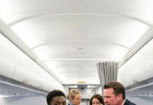 I was stuck beside a billionaire’s son, his sobs ripping through the cabin for three straight hours. Passengers hissed, a flight attendant whispered, “We’ve tried everything,” and I just sat there—numb. Then a poor Black teen, maybe sixteen, in worn-out clothes, stood up. “Let me try,” he said calmly. People snickered… until the crying stopped dead. He leaned in and murmured something I couldn’t unhear. My stomach dropped. And that was only the beginning.