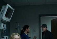 I wake up under hospital lights again, my skin a map of purple bruises. Mom is beside me, smoothing my hair with trembling fingers. “It was an accident,” she whispers to the nurse—too fast, too practiced. I try to speak, but my throat burns. In the hallway, I hear his boots… and his laugh. Mom leans closer, eyes glossy, voice barely there: “Please… don’t tell them.” Then she slips something into my palm—a key—and I realize this wasn’t “vô tình.” Not ever.