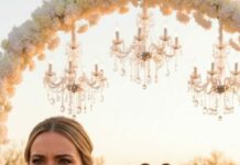 I stood at the altar ready to say “I do,” when my fiancé leaned in and whispered, “Smile—this is going to be fun.” Then he turned to the crowd and laughed, “Everyone, she wants to read her vows… but maybe she should explain those messages first.” Gasps sliced through the room. My hands went numb—until his phone buzzed loudly on the mic stand. A voice message played: “We have the footage. Police are on the way.” And suddenly, everyone was staring at him.