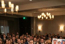 I thought my wife was about to toast my 42nd birthday—until she tapped her glass and said, “I’m divorcing you. Tonight. In front of everyone.” The music cut. A hundred faces turned. Her father stepped up with an envelope and growled, “You owe us $248,000.” Then my boss walked onstage and whispered, “HR says you harassed a coworker. You’re fired.” I stared at the pen in my hand and realized… this wasn’t a party. It was an execution.