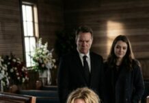 At my daughter’s funeral—eight months pregnant—the incense burned like a knife in my throat. I was on my knees when my husband walked in, clutching his mistress’s hand, eyes red like a rehearsed scene. He leaned close and hissed, “This is the price you deserve.” I froze. “Price for what?” I choked. She smirked, squeezing his fingers. Then I saw it—tucked beneath the shroud on my daughter’s belly: “Mom, don’t trust him.” And suddenly, the coffin didn’t feel quiet anymore.