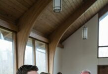 They stared the second the homeless man shuffled into Grandpa’s funeral, coat torn, eyes locked on the casket. “Get him out,” my dad hissed, face burning. My aunt grabbed my arm—“Don’t you dare stand near him.” But I stepped beside the stranger anyway. He leaned close and whispered, “He promised you’d protect me.” Minutes later, the lawyer opened the will. “To my son…” Then paused. “No— to him.” And my family went silent. What Grandpa hid… was just beginning.