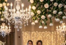 At my sister’s wedding, I tried to disappear behind the champagne flutes—until she raised her glass and smiled at me. “Some people marry rich,” she purred, “and some people raise spoiled, broken kids.” Laughter cracked through the room. Then Mom chimed in, loud enough to sting: “At least her broken kid wears shoes!” My cheeks burned… until a tiny voice tugged my dress and whispered, “Mom, should I tell them?”