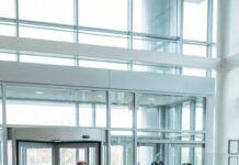 At my wedding, Grandma pressed a $500,000 check into my palm like it was a blessing. My parents burst out laughing. “That’s fake,” Mom hissed. “Don’t you dare embarrass us at the bank.” I swallowed my anger, smiled for the photos—and went anyway. The teller’s face drained white as she scanned it. “Sir… this account was closed after a death.” My stomach dropped. Grandma was standing right behind me. Smiling.