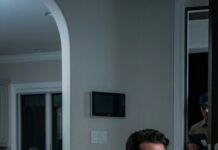 I came home early, still wearing my billionaire smile—until I heard her crying like someone had died. My pregnant wife was curled on the kitchen tiles, hands slick with red. “Tell me it’s not ours,” I whispered. She looked up, eyes empty. “It happened… because of you.” I froze. “What did you do?” She shook her head, voice breaking. “No… what you signed.” Then the doorbell rang—soft, polite. A man’s voice: “Delivery for Mr. Tran.” And I realized the worst hadn’t arrived yet.