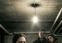 I was eight months pregnant when they shoved a hood over my head and dragged me into the dark. “Don’t scream,” a woman hissed, nails digging into my wrist. “You’ll hurt the baby.” I begged through my sobs, “Please… just let us go.” Then a familiar voice cut through the silence—calm, intimate, cruel. “She’s stronger than she looks.” My blood went ice-cold. That voice… was my husband’s. The hood came off, and I saw his hand in hers. I didn’t faint. I didn’t break. I smiled—because they had no idea what I’d already hidden, and who I’d already warned.