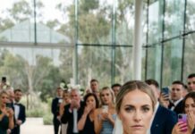 The night before my wedding, I froze outside the door and heard him laughing with his friends. “Relax,” he said. “She’s just a temporary choice—until someone better shows up.” My stomach turned to ice, but my face stayed calm. Next morning, he waited at the altar, smug and shining. I walked in—eyes on him—yet not to become his wife. I raised the envelope and whispered, “You wanted better?” Then the surprise hit, and he dropped to his knees… But that was only the beginning.