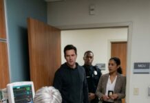 Just hours after my emergency C-section, my mother-in-law burst into my recovery room like a storm. “You couldn’t even give me a grandson!” she screamed, slamming her heavy handbag straight onto my fresh stitches. Pain exploded through me as she grabbed my hair and yanked my head back. “My son is leaving you for a woman who actually knows how to breed!” she hissed, then spat in my face. She lifted her hand to strike again—until she noticed someone standing silently in the doorway. One look at who it was stopped her cold… and what happened next left the entire hospital frozen….