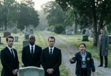 I came to Mom’s grave with a knot in my throat and questions that never stop bleeding. Morning was supposed to be quiet—until I saw them: men in black suits, spaced around the headstone like guards. Power. Precision. Watching. “Who are you?” My voice shook. One of them didn’t look at me. “You shouldn’t be here.” My stomach dropped. “She was poor. Forgotten. Why do you care?” No answer—just a glance at the dirt, like it might open. And then I noticed the fresh flowers… with no name on the card.