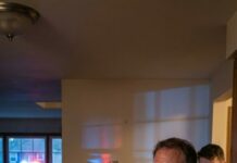 I hired a guy to mow the lawn while my daughter was out of town—simple, harmless. Then, an hour later, my phone buzzed. His voice was barely a breath: “Sir… is anyone else in the house right now?” My stomach dropped. “What do you mean?” I snapped. He swallowed hard. “I hear crying… from your basement. And it’s not the TV.” I froze—because I didn’t have a basement door key anymore… but someone did.