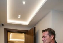 I still remember the way her bruised face looked under the streetlight—my daughter, curled up on the pavement, clothes torn, breathing like she was afraid to take up space. “Dad… don’t call him,” she whispered. I carried her home. But at sunrise, I went to their luxury apartment. He opened the door, smug—until I smiled and said, “I’m not here to beg. I’m here to collect.” His expression cracked. And that was only the beginning.