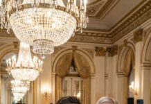 The chandelier’s glare shattered across my wineglass as I stood in the grand hall. “I’m done hiding,” I said, my voice cutting through the violins. Her fingers crushed mine—trembling. “Don’t… not tonight.” But I turned to the throne anyway and confessed the forbidden truth. The room froze. Then a soft laugh breathed behind me: “At last, my son.” My stomach dropped—because that voice… belonged to the one person I never imagined. And suddenly, everyone was watching.