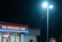 I ran toward him when he screamed—until he suddenly went silent, staring past my shoulder like he’d seen a ghost. “Don’t… move,” he whispered, voice cracking. I turned and saw the man in the suit by the car, calm as stone, watching us like we were a mistake he could erase. My stomach dropped. “Who are you?” I asked. He smiled. “You already know.” And that’s when my phone buzzed with the truth.