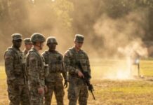 I still remember the laughter the moment they saw the tattoo on my neck. “Hey Sergeant, those coordinates your boyfriend’s house?” someone joked across the range. I didn’t answer—I just picked up the rifle and squeezed the trigger. The steel target half a mile away rang like thunder, and suddenly the jokes stopped. Then the admiral whispered a name that froze everyone in place: “Phantom Six… it’s really you.” That’s when they realized the tattoo wasn’t decoration—it was a battlefield.