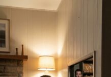 Today, while packing up the house, I dropped my ring. As I knelt to find it, my fingers brushed against a hidden switch beneath the floorboard. Click. A door slid open inside the wall. My heart stopped when I heard my husband’s voice from the darkness: “You were never supposed to find this.” I should’ve run. Instead, I stepped inside… and saw the truth that changed everything.