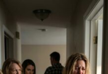 The moment my mother raised a baseball bat and shouted, “Get out of that room! It belongs to your sister now!” I realized something none of them knew. My shoulder burned where the bat hit, my sister stood there smirking, and my father stared at the floor. They thought they had just thrown me out of my own bedroom… but they had no idea the house was legally mine. What happened next destroyed my family forever.