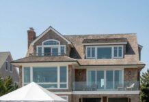 I pulled into the driveway of my beach house expecting a quiet weekend—until I saw a full wedding setup in my backyard and my sister holding a clipboard like she owned the place. When I asked what was happening, she smiled and said, “Oh… didn’t Mom tell you? The wedding is here.” I stared at the invitation on the table—my house listed as the venue, my permission never asked. That’s when I realized something shocking: my family thought my home belonged to them.