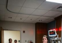 I froze in horror as my sister yanked out her oxygen tube and screamed, “Help! She’s finally done it! My sister-in-law wants my house, and now she’s trying to kill me!” Before I could speak, she grabbed the metal IV stand and slammed it into my eight-month pregnant belly. “How dare you try to murder your own family?” she shrieked. When I woke up, the doctor leaned close and whispered, “There’s something you need to know about your baby…”