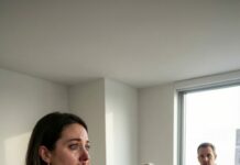 I was smoothing the tablecloth, ready to celebrate our new home, when my husband smiled at his mother and asked, “Mom, have you thought about when you’ll move your things into your new apartment?” I barely had time to process the audacity before my father rose to his feet. Then he dropped one sentence that made my mother-in-law choke—and turned my husband to stone. What happened next changed everything.