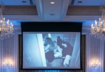 After my sister stole my fiancé and used my $400K wedding deposits to plan her own wedding, my parents still forced me to attend and give her a gift. I stayed silent and smiled. But on the wedding day, with all the guests watching, I revealed a video exposing their secret scheme against me… and the groom’s reaction changed everything forever.