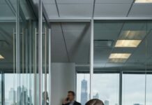 I’m Lucas Grant—Chicago’s coldest developer, a man who trusts contracts more than people. So I staged a collapse on my office floor, waiting for Emily Carter to panic… or steal. She didn’t. She straightened my papers, fixed my jacket, and left a glass of water like I was human. In the hallway, her voice cracked: “Noah, breathe… we’ll get you through the hearing test.” That’s when my “test” shattered—and a bigger one began.