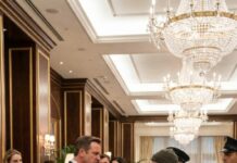 Marble floors. Crystal chandeliers. A five-star Manhattan lobby. “Sir, you can’t be in here,” the guard snaps. The old man steadies his breath and replies, “I’m here to book a room.” The manager strides over, eyes cold. “Get this homeless guy out—NOW.” Gasps ripple through the crowd as the old man calmly sets a sealed envelope on the counter and whispers, “Before you do… read that.” What’s inside will change everything—and someone’s career won’t survive the next 24 hours.