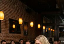 Red wine dripped into my eyes while fifty strangers watched like I was a live show, and the woman standing over me screamed, “My husband owns this restaurant, and you don’t belong here!” I wiped my face slowly and said the only thing that mattered: “I hope that made you feel better.” What she didn’t know was that I owned 40% of the place she was defending—and one forgotten document was about to destroy everything she thought was hers. She humiliated me in public, but she had no idea she’d just started a war she couldn’t win.