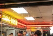 I was just a quiet waitress pouring coffee when a biker grabbed my apron and laughed, “Take it off… let’s see what you’re hiding.” The whole diner started filming. I whispered, “Last warning… let go.” He smirked and pulled harder. Then the Navy SEAL in the corner stood up and his K9 exploded into a violent bark. The biker thought he had trapped a helpless waitress… but he had no idea he’d just put his hands on Commander Olivia Hayes.