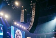 My mother’s voice built an empire. Mine built a lie.” For years, I smiled under the spotlight, lip-syncing my way through sold-out arenas, living off her name and the illusion that I was just as gifted. Then, in the middle of my biggest performance, the mic slipped from my hand and crashed to the stage—while the song kept playing. The crowd went silent. My mother stood backstage, whispering, “What have you done?” And that was the moment everything began to burn.