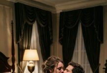 I was sold in a wedding dress. “Marry him, or your father goes to prison,” my mother whispered, while I cried so hard I could barely breathe. He was the disabled heir of the richest family in town—and I was just the poor daughter they chose to pay a debt. But on our wedding night, he looked at me and said, “You think you’re the sacrifice? You have no idea what they stole from you first.”