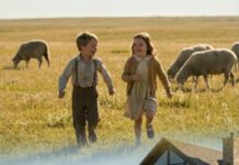 I still remember her laughter echoing through the thin wall back in seventh grade—soft, familiar, the kind of laughter I kept hidden in my heart. Then we were separated, and ten years passed like a door slamming shut. Tonight, I see her again… and my heart feels frozen. She steps out of a luxury car, her eyes cold. A man wraps his arm around her. Two children cling tightly to her coat. “Please,” I whisper, “tell me that’s not you.” She doesn’t even blink. “You’ve got the wrong person.” What happened to the girl next door I had secretly loved…?