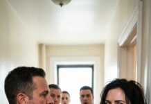 She stepped into the taxi in a simple red dress, trying to forget the badge for one night—until the driver whispered, “Ma’am… they shake us down here.” Red-and-blue lights flared. Sergeant Davis leaned in, smirking: “Five hundred, or I tow your cab.” Sarah’s voice cut through the fear: “Write a real ticket—or walk away.” He laughed, snapping cuffs. “You’re coming with me.” Then the precinct door opened—and everything changed.