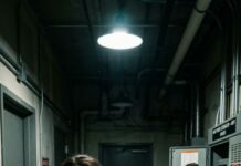 I thought I was immune to tragedy—until he leaned in and said, “I’ll handle the funeral. Don’t trouble yourself.” His voice was soft, like he was offering flowers. I snapped, “No one here is waiting to die.” He tilted his head. “They won’t be safe… if you don’t cooperate.” That night, the nursing home power cut out. Ventilators stuttered—one dead pause—then hummed back. In the dark, I heard a quiet laugh outside the generator room. By morning, one resident was gone—eyes wide open, like they’d seen something they were never meant to. And I realized… he was only warming up.