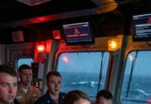 The night the radios went dead, I heard the fear before anyone said it out loud. “We’re losing the aircraft—signal’s collapsing!” someone shouted, and for a heartbeat the room froze. I stepped forward, calm as the storm outside. “Switch to 325. Now.” They didn’t know I was their admiral yet. They only heard my voice cut through chaos—and chose to trust it. That was the moment everything changed.