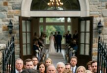 I arrived late to my own wedding because I’d been pulled into an emergency surgery. Still in my coat, I rushed to the venue—only to have a wall of my husband’s relatives block the gate. One woman screamed, “My son married someone else. Get out!” People started filming. I swallowed the humiliation and said, “Open the doors.” She smirked. “Prove it.” That’s when I reached into my pocket… and everything changed.